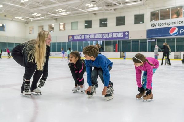 Ice skating Orlando: image of teacher and children ice skating at the RDV Ice Den in Maitland, Florida