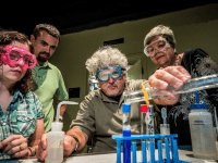 Orlando events: image of adults doing experiments at Orlando Science Center Science Night Live event