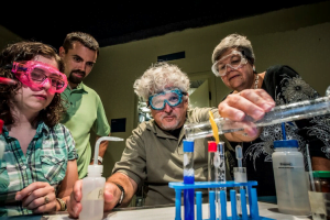 Orlando events: image of adults doing experiments at Orlando Science Center Science Night Live event