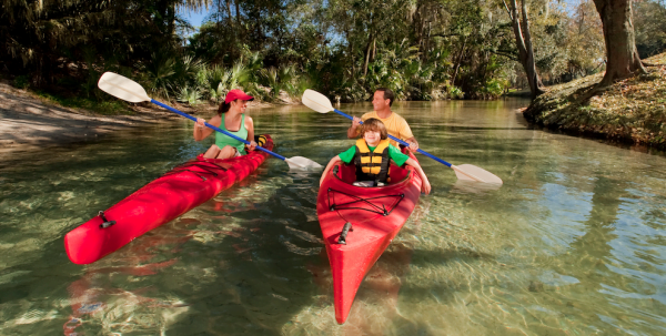 Things to do with kids in Orlando: image of family kayaking in the Central Florida Springs near Orlando.