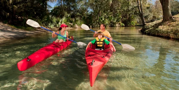 Things to do with kids in Orlando: image of family kayaking in the Central Florida Springs near Orlando.