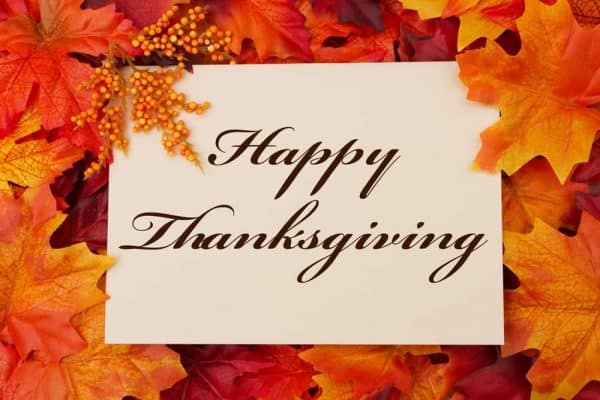 Thanksgiving restaurants: Happy Thanksgiving graphic with fall leaves