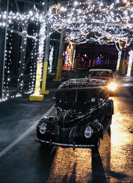 Orlando Christmas lights: image of car driving through lights display at Daytona Speedway