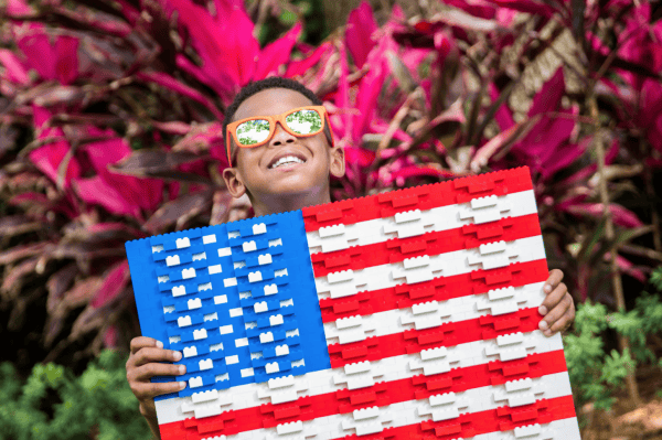 Veterans discounts LEGOLAND Florida: image of child holding American Flag made out of LEGOS