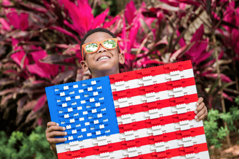 Veterans discounts LEGOLAND Florida: image of child holding American Flag made out of LEGOS