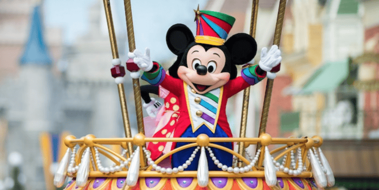Disney Festival of Fantasy Parade at Magic Kingdom: image of Mickey Mouse waving on parade float