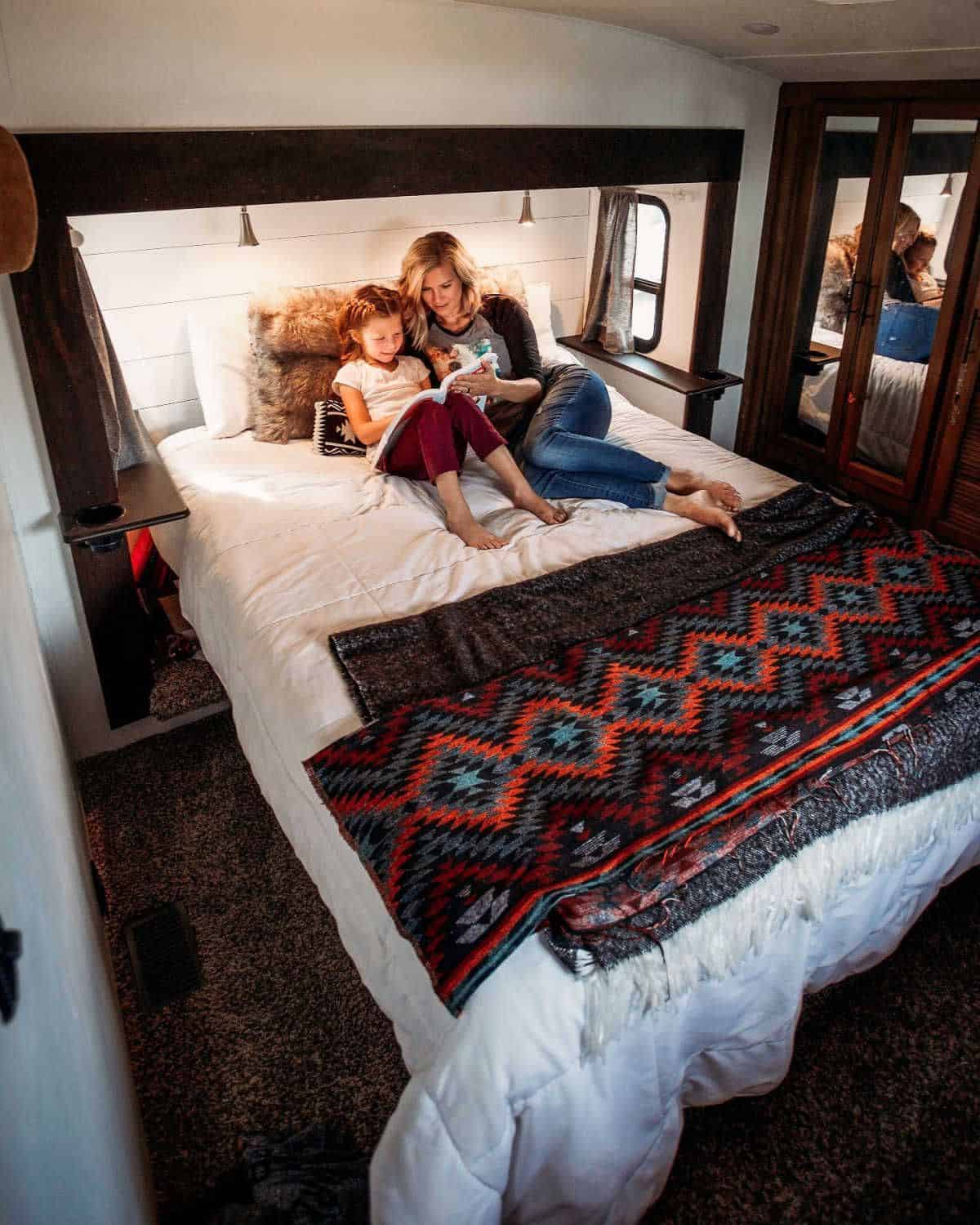Orlando RV rentals: image of mom and daughter enjoying RV while camping