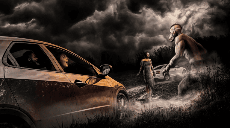Halloween Orlando: image of car driving through a scary scene during the drive-thru Halloween experience in Orlando, the Haunted Road