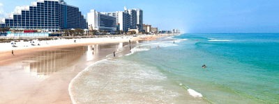 Free & cheap things to do in Daytona Beach: image of beautiful beach shoes and hotels at Daytona Beach, Florida just a short drive from Orlando