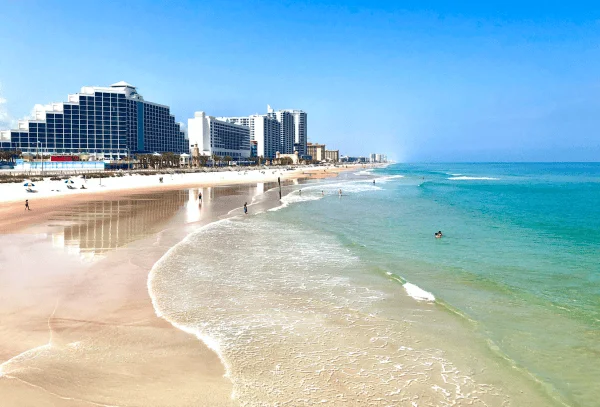 Free & cheap things to do in Daytona Beach: image of beautiful beach shoes and hotels at Daytona Beach, Florida just a short drive from Orlando