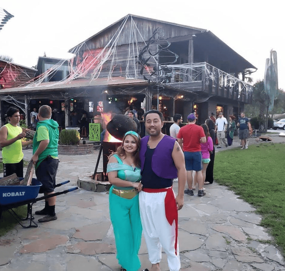 Halloween events Orlando: image of a couple dressed in a Halloween costume at Wekiva Island in Longwood near Orlando during their annual Halloween costume contest evetn