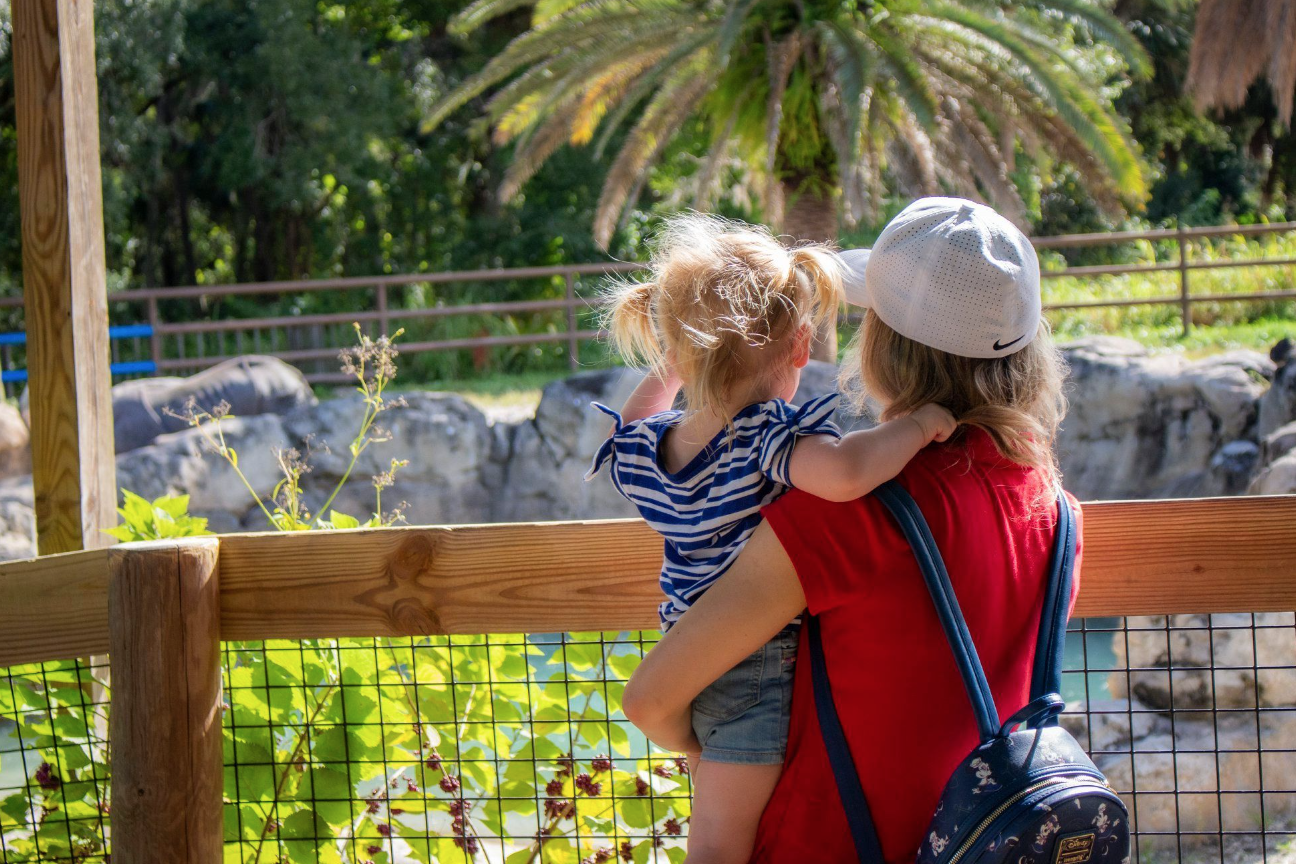 Things to do in Orlando: image of a mom and toddler looking at an animal exhibit at the Central Florida Zoo & Botanical Gardens in Sanford, Florida