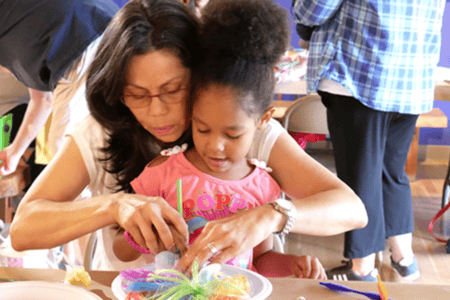 Things to do Orlando: image of a mom and daughter make a free craft at the Mennello Museum of Art in downtown Orlando