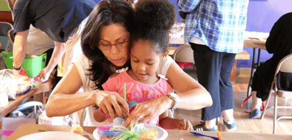 Things to do Orlando: image of a mom and daughter make a free craft at the Mennello Museum of Art in downtown Orlando