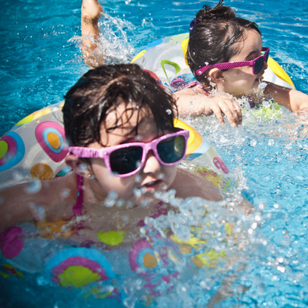 Children swimming pool with sunglasses and floaties